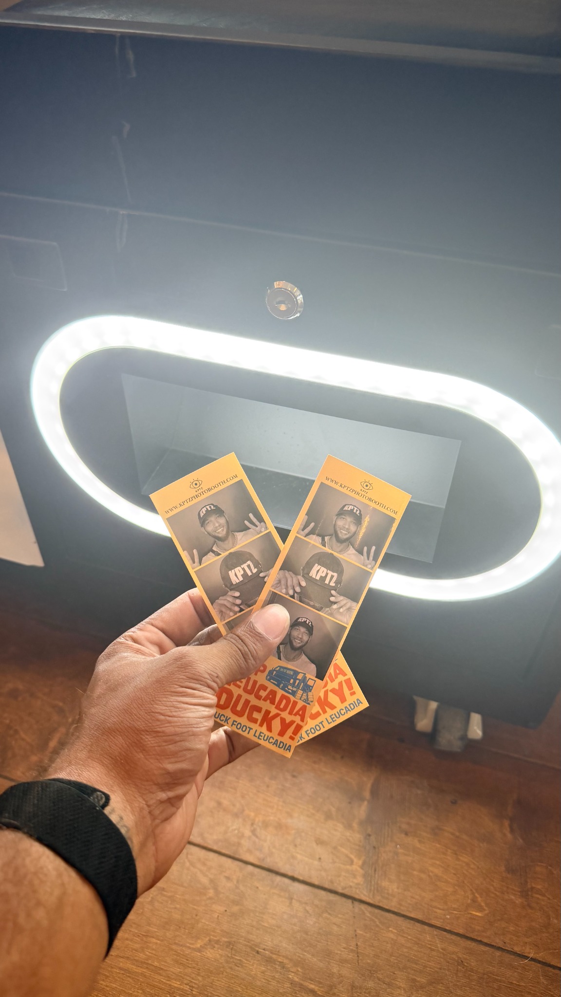 Two printed photo strips from the KPTZ Classic Photo Booth